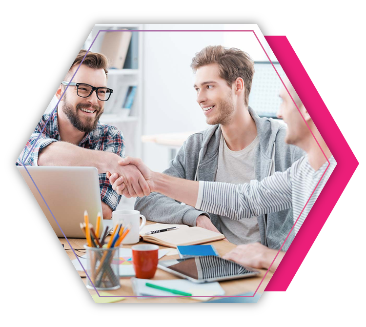 Three happy students are utilizing the benefits of Grab Agile by sharing their knowledge with a handshake